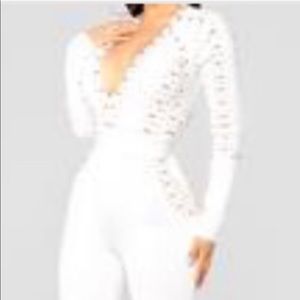 All white fashion nova jumpsuit with gold accent